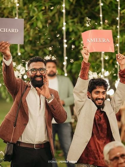 The groom's friends cheering him on during the wedding festivities. The energy and support from friends make for fantastic, dynamic shots.