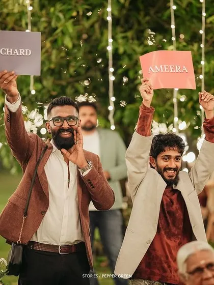 The groom's friends cheering him on during the wedding festivities. The energy and support from friends make for fantastic, dynamic shots.