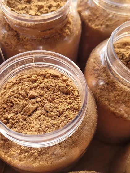 Jars of my Chocolate Ubtan, a traditional Indian face mask powder that smells divine and works wonders on tan and spots.