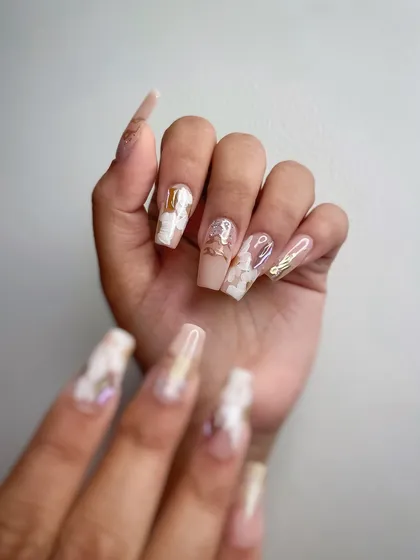 A close-up of the trending paste gel flower nails, perfect for a wedding or special event. The combination of a milky base, chrome, and 3D flowers creates a luxurious and detailed look.
