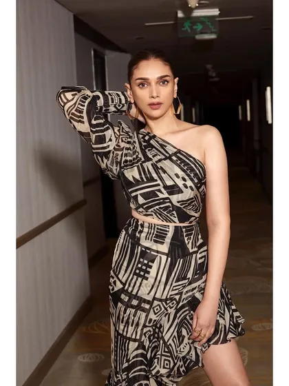 This one-shoulder printed set by Nikita Mhaisalkar is edgy and cool. The abstract black and white print and asymmetrical design make it a great choice for a party.