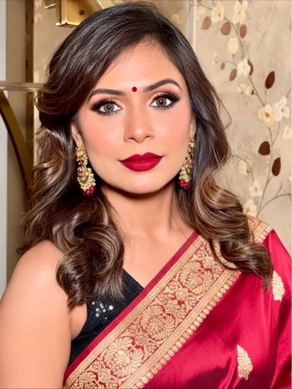 A front-facing portrait of my Navratri makeup look. The combination of a bold red lip and smokey eyes is a timeless choice for any festive occasion, creating a look that is both traditional and trendy.