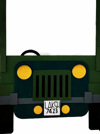 This custom cardboard jeep was built as an interactive photo prop. I even added a personalized license plate with the birthday boy's name, 'LAKSH', making it a unique and memorable piece for his army-themed party.