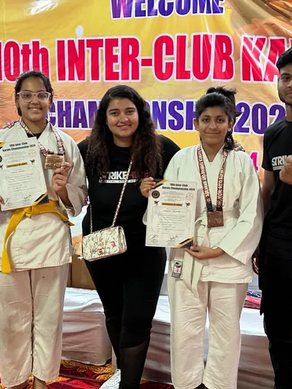 Our young female competitors with their medals and certificates. We are proud to have a strong representation of girls in our karate program.