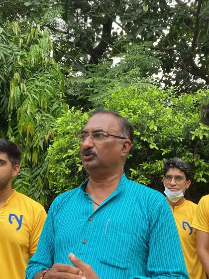 A local leader speaking to our volunteers, offering his support and encouragement for our community initiative.