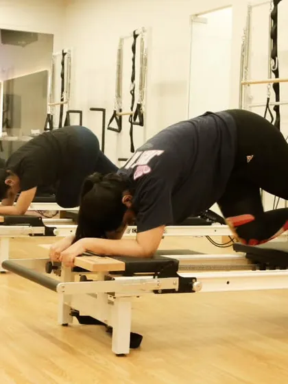 The plank is a fundamental core exercise. Here, my clients hold a strong plank on the reformer, which adds an element of instability to challenge the core even more.