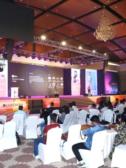We excel at capturing the full scale of your event. This wide-angle shot of the UXINDIA 2024 summit shows the large, engaged audience and the professional stage production, demonstrating our capacity for covering major conferences.