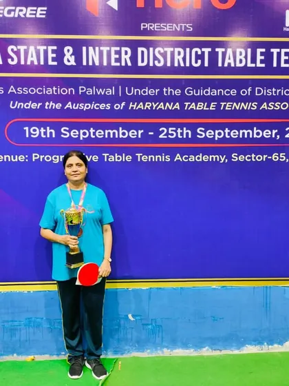 It's not just about the juniors. Here is one of our dedicated adult players with her trophy after securing 3rd place in the Haryana State Championship. I believe in providing a competitive platform for every age group.
