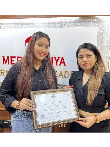 We celebrate every student's success. Here is another graduate receiving her certificate, ready for a new chapter.