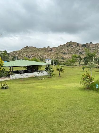 Our open-air yoga shala is nestled in the landscape, offering a sheltered space to practice while still feeling connected to the surrounding hills and greenery, even on a cloudy day.