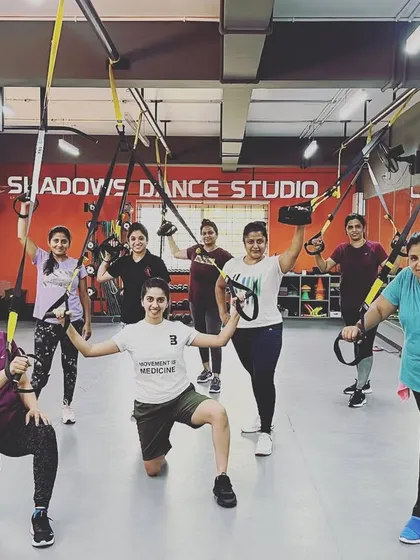 A snapshot from one of our popular TRX group classes. Our members use suspension training to build total-body strength, balance, and core stability under the guidance of our expert trainers.