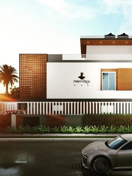 A perspective of the Siruguppa residence at sunset. The clean white facade is contrasted with the warm texture of the jali screen, creating a simple yet elegant exterior design.