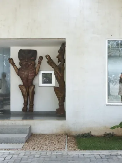 For this office extension in Coimbatore, courtyards separate the old and new zones. This exterior view shows how the building frames views of the garden and art, using the landscape to organize the architectural program.