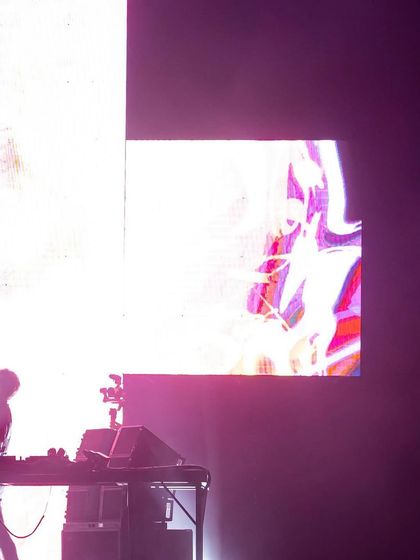 Another angle of the silhouetted performer, showcasing the scale of the LED screens I use in my productions.