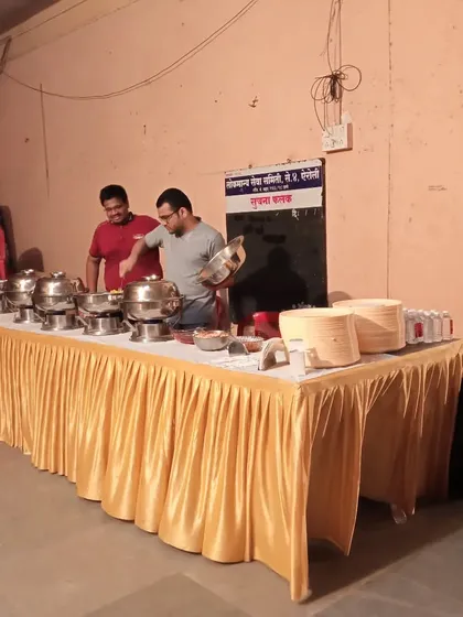 Our team setting up the final touches on a buffet line. We ensure everything is perfect before the service begins.