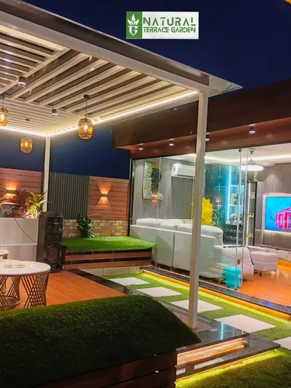 This shot captures both the cozy interior of the glass house and the adjacent open-air pergola lounge. It demonstrates how we can create distinct functional zones within a single terrace project.