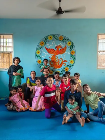 A group photo of our happy children and volunteers at the Phoenix Rising library in Pune. We are so glad to be back, contributing to our mission of healing through stories.