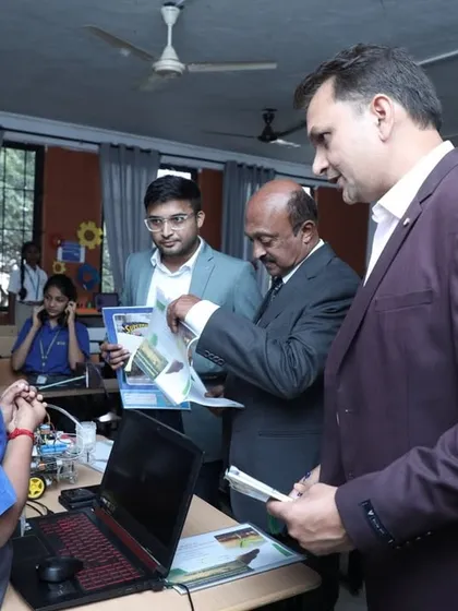 A young student presents his project to judges and guests. These opportunities are vital for building the presentation skills needed for a successful career in tech.