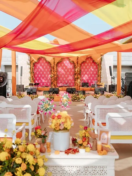 We brought the vibrant spirit of a traditional Indian Mela to life for Neomi and Rakshit's 'Jaipur Wali Haldi'. The space was bursting with bright oranges, pinks, and yellows, complete with colorful drapes and festive seating to create an atmosphere of pure joy.