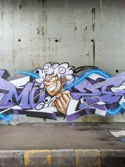 As a huge One Piece fan, I had to celebrate Luffy's Gear 5 transformation. I combined my sharp, energetic lettering with Luffy's iconic new form, creating a powerful piece that took about five hours of solo work on the street.