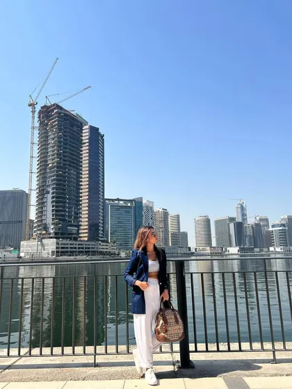 Taking in the Dubai skyline. A well-fitted blazer is a travel essential that can instantly elevate any casual outfit.