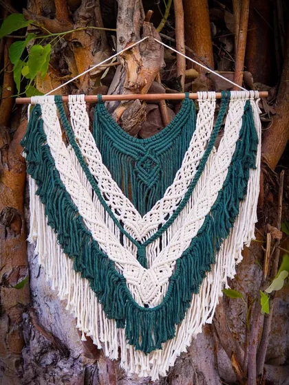 A closer look at the detailed knotwork in the green and white macrame hanging. I use different knotting techniques to create depth and interest, all done by hand with high-quality cotton cord.