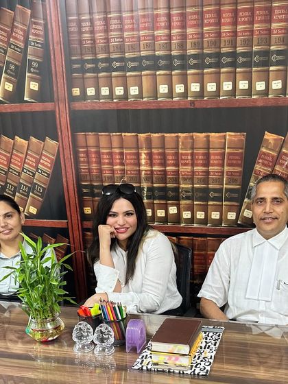 In my office with colleagues. Advocates play a crucial role in society by defending the legal rights of individuals and ensuring fair access to the justice system.