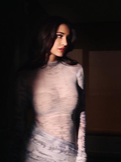 This moody, atmospheric shoot features Disha Patani in a sheer printed dress by Deme Love for the 'Kanguva' promotions. The styling here was about creating an alluring and mysterious vibe, playing with light and shadow.