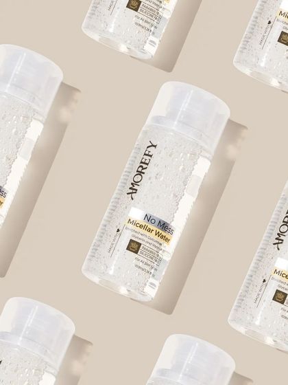 A creative pattern shot of micellar water bottles. Repetitive patterns are visually striking and work well for social media banners and backgrounds.