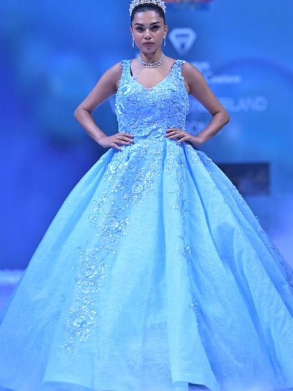 This powder blue ball gown is pure Cinderella magic. The voluminous skirt is covered in delicate floral embroidery that glimmers under the lights, making it a true showstopper from my GULFAM collection.