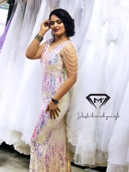 The full-length view of the iridescent sequin gown shows its sleek, body-hugging fit, perfect for a sophisticated and glamorous look.