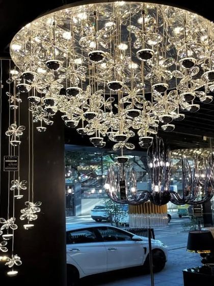 A beautiful cascading crystal chandelier that creates a sense of movement and delicacy.
