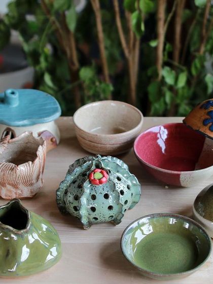 A playful and imaginative collection of hand built and altered forms, including a house shaped luminary and a cactus inspired pierced vessel.