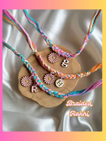 Our beautiful braided rakhis with daisy charms and personalised initials. The multi-color thread is vibrant and fun.