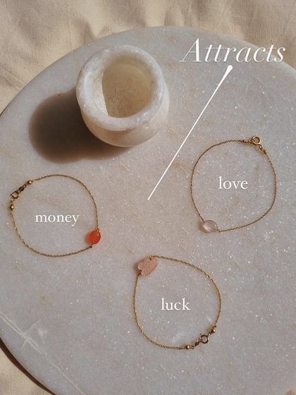 This image shows three of my healing charm bracelets. The Carnelian oval bracelet is for money and prosperity, the Rose Quartz is for love, and the Peach Moonstone is for luck.