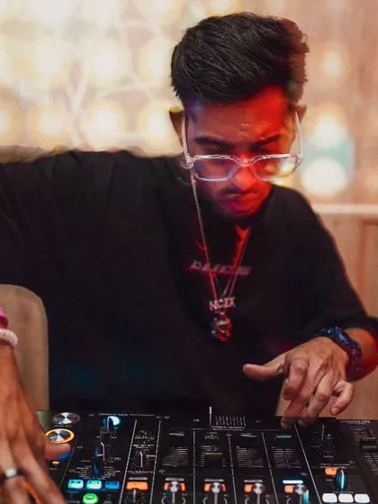 Real Trendsetter, I Don't Steal Style. A close up shot of me at the console, focused and in control. This reflects my confidence and originality as an artist.