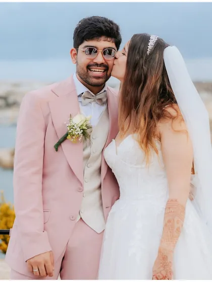 A sweet kiss on the cheek. We love capturing these candid, affectionate moments between our couples.