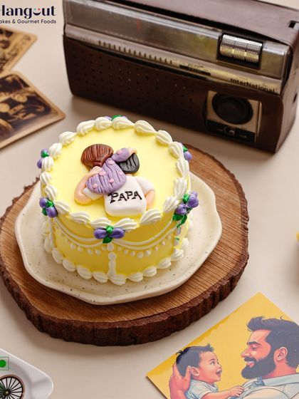 This Alphonso Mango Bento Cake was designed for Father's Day. The cake is topped with a caricature of a father and child, adding a personal and emotional touch to a delicious seasonal favorite.