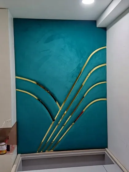A truly unique headboard design. This piece features teal suede fabric with curved, gold-finished metal inlays, creating a stunning, art-deco inspired focal point for the bedroom.