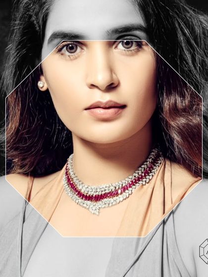 This stunning necklace is crafted in 18kt gold, adorned with marquise diamonds and vibrant marquise Burmese rubies.