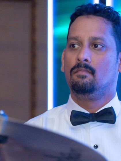 Our drummer, the heartbeat of the band, keeping the rhythm tight for the Apollo Hospitals corporate event.