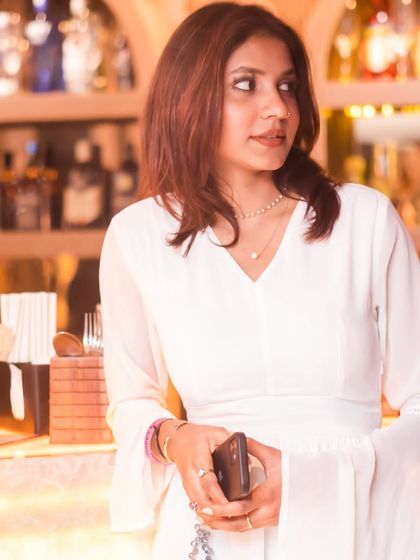 A candid shot of a guest by the well-stocked bar.