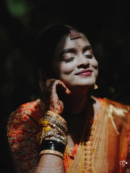 A stunning bridal portrait bathed in the soft glow of sunlight. I focus on capturing the bride's elegance and emotion, creating a timeless image that reflects her inner radiance on her special day.