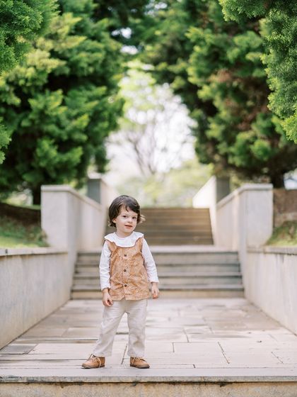 This little boy was a natural model, exploring the park with confidence. I find that every child has their own unique charm, and my job is to capture it.