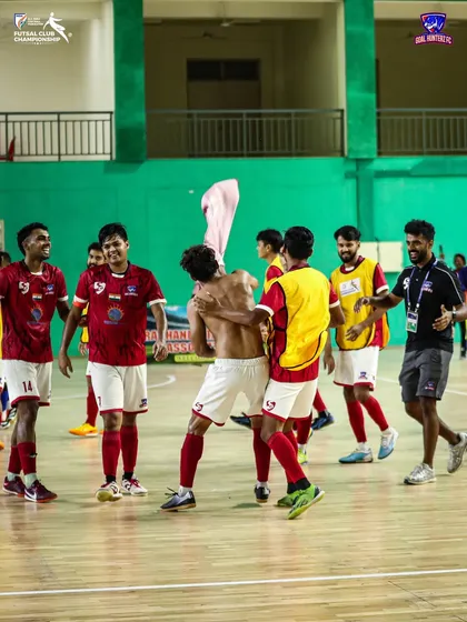 The joy of victory. A player celebrates shirtless after a hard-fought win.