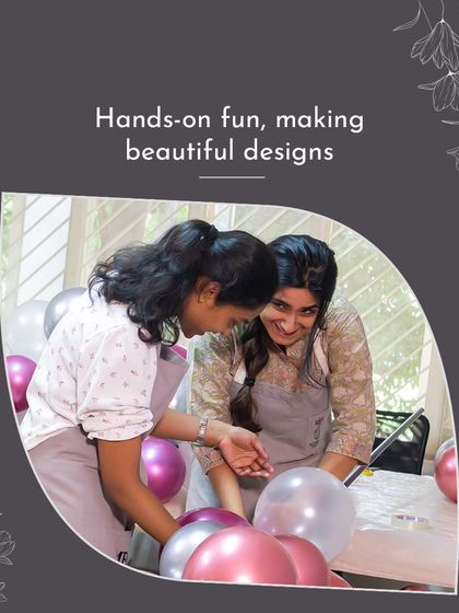 Two students share a laugh while working on their project. This shows the hands-on fun and supportive community that is a hallmark of the MMDS experience.