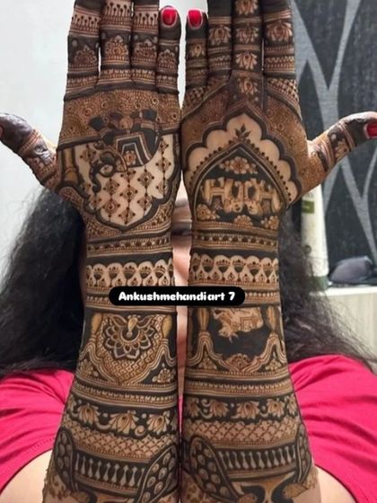 A full-coverage design with dense, traditional patterns, featuring elephants and a kalash, perfect for a grand bridal look.