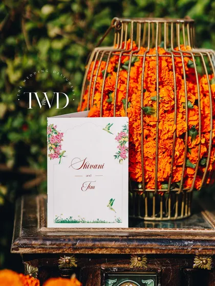 Personalized stationery, like this welcome card, makes guests feel special. The design was coordinated with the overall garden Mehendi theme.