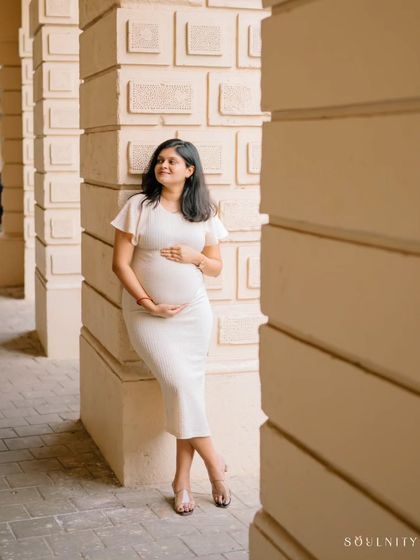 A moment of quiet contemplation. Using the beautiful architecture of Mumbai as a frame, this solo portrait feels both strong and serene.