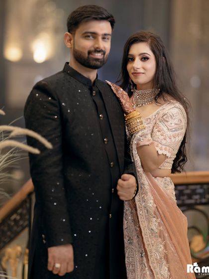 A happy and relaxed portrait of the engaged couple. Their smiles and easy posture show their comfortable chemistry and joy.